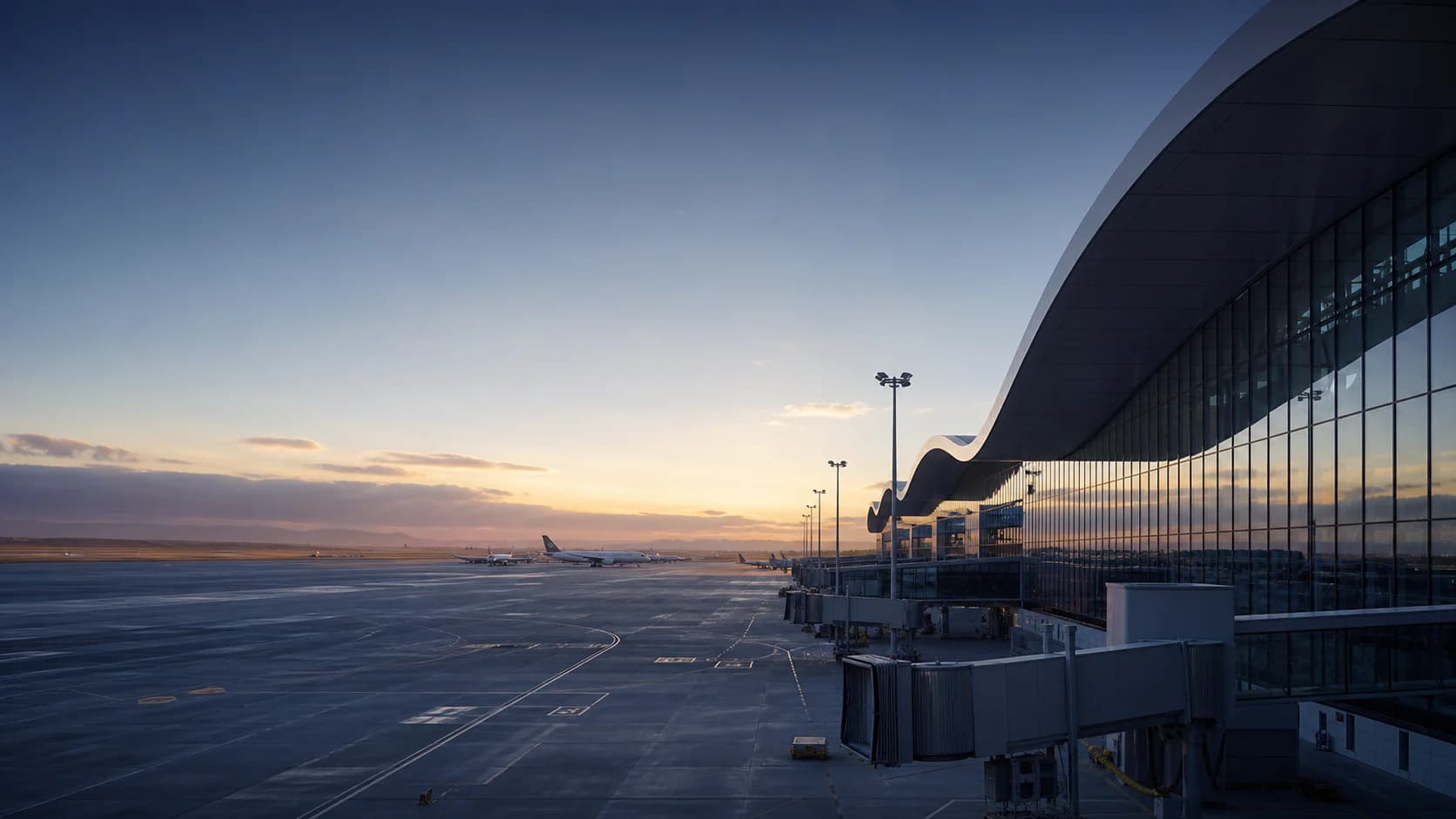 Conceptual modern airport terminal and airfield at dawn